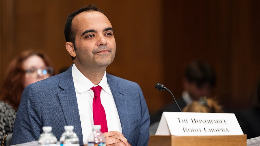 Consumer Financial Protection Bureau Director Rohit Chopra listens during a committee hearing.