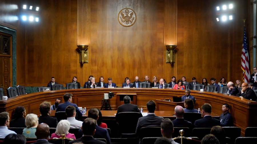 NYU Professor Emeritus Gary Marcus, center, speaks before a Senate Judiciary Subcommittee on Privacy, Technology and the Law hearing on artificial intelligence, Tuesday, May 16, 2023, on Capitol Hill in Washington. Seated alongside Marcus are OpenAI CEO Sam Altman, left, and IBM Chief Privacy and Trust Officer Christina Montgomery. (AP Photo/Patrick Semansky)