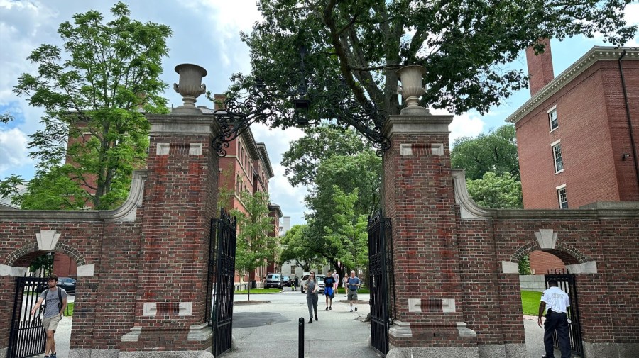 Students walk through a gate at Harvard University, Thursday, June 29, 2023, in Cambridge, Mass. The Supreme Court on Thursday struck down affirmative action in college admissions, declaring race cannot be a factor and forcing institutions of higher education to look for new ways to achieve diverse student bodies. (AP Photo/Michael Casey)