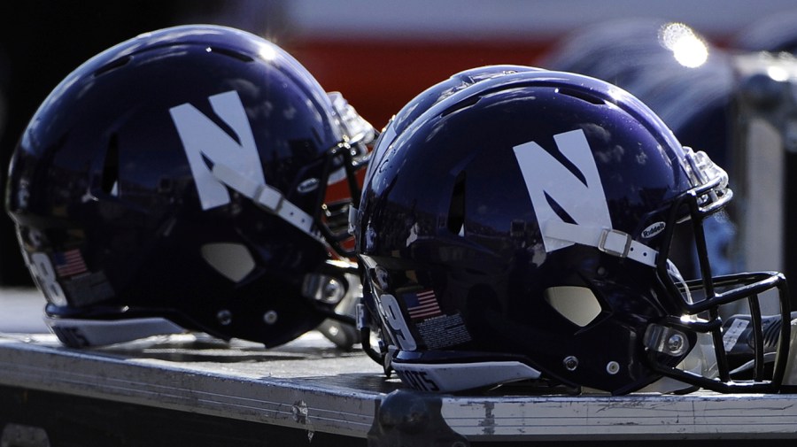 FILE - Northwestern helmets are shown during an NCAA college football game against Iowa in Evanston, Ill.