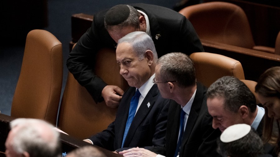 Israel's Prime Minister Benjamin Netanyahu, center, is surrounded by lawmakers at a session of the Knesset, Israel's parliament, in Jerusalem, Israel, Monday, July 24, 2023. (AP Photo/Maya Alleruzzo)