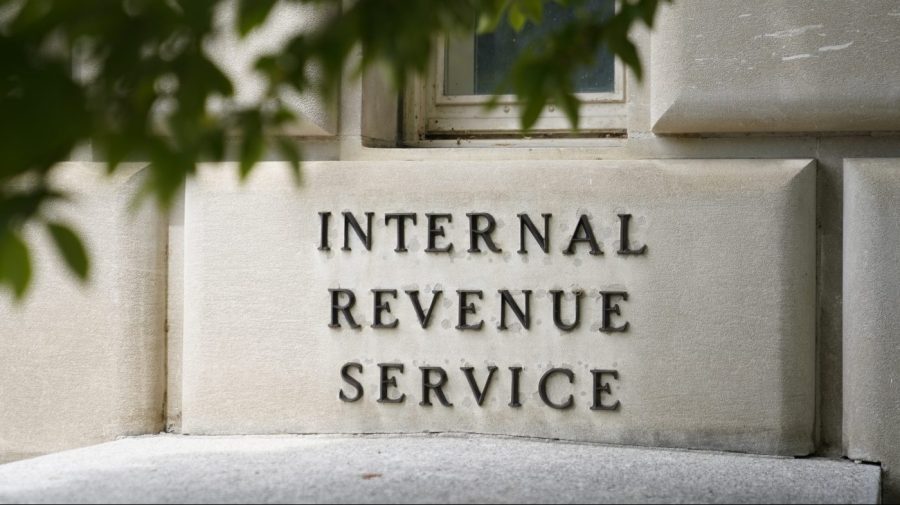 FILE - A sign outside the Internal Revenue Service building in Washington, on May 4, 2021. Most taxpayers will be able to digitally submit a slew of tax documents and other communications to the IRS next filing season and the agency plans to go completely paperless in 2025. (AP Photo/Patrick Semansky, File)