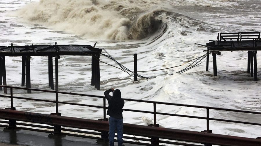 FILE - Powerful waves batter the Capitola Wharf after the storm destroyed a section of the structure on Jan. 5, 2023, in Capitola, Calif. Giant waves, measuring as high as 13 feet, are becoming more common off California's Pacific coast as the planet warms, according to new research that used a unique approach to gather historical data over the past 90 years to track the increasing height of the surf. (Shmuel Thaler/The Santa Cruz Sentinel via AP, File)