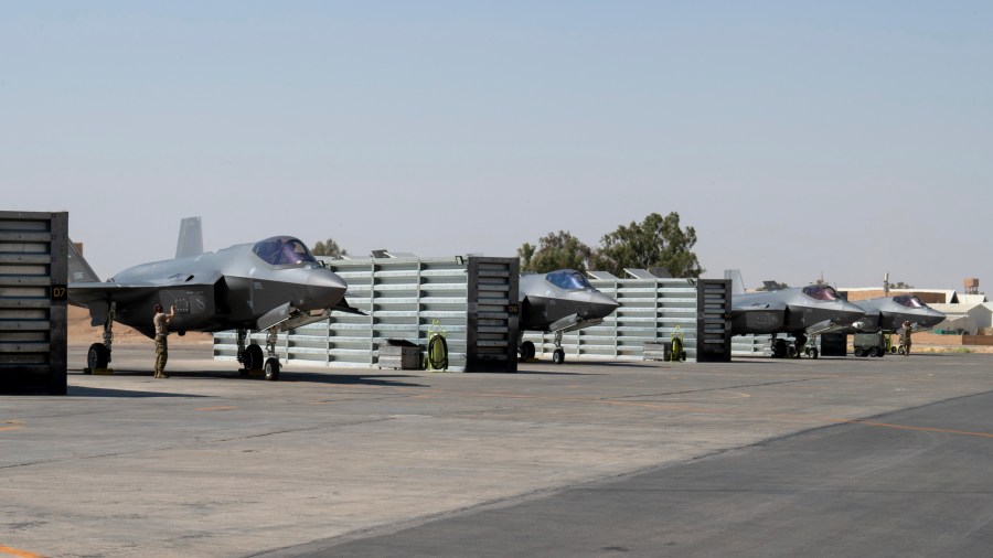 In this handout photo from the U.S. Air Force, U.S. Air Force F-35A Lightning II fighter jets stand parked at an undisclosed location in the Middle East on July 25, 2023. The U.S. military is considering putting armed personnel on commercial ships traveling through the Strait of Hormuz, in what would be an unheard of action aimed at stopping Iran from seizing and harassing civilian vessels, four American officials told The Associated Press on Thursday, Aug. 3, 2023. (Staff Sgt. Christopher Sommers/U.S. Air Force, via AP)