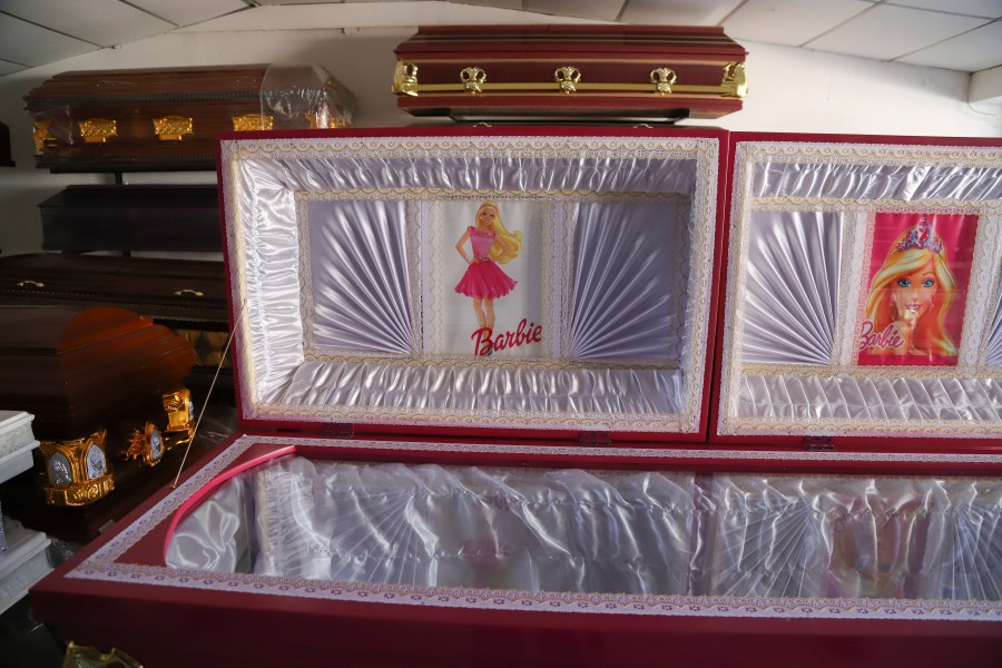 A pink colored coffin featuring a Barbie motif is displayed at a funeral home in Ahuachapan, El Salvador, Friday, Aug. 4, 2023. According to the funeral home manager, the idea was well received as a joyful atmosphere to the loss of a loved one. (AP Photo/Salvador Melendez)