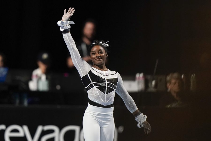 Simone Biles waves at the U.S. Classic gymnastics competition Saturday, Aug. 5, 2023, in Hoffman Estates, Ill. (AP Photo/Morry Gash)