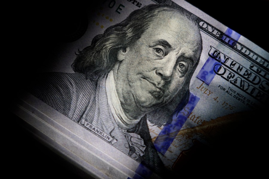 File - The likeness of Benjamin Franklin is seen on U.S. $100 bills, Thursday, July 14, 2022, in Marple Township, Pa. With the help of technology, scammers are tricking Americans out of more money than ever before. But there are steps you can take to keep your money and information safe. (AP Photo/Matt Slocum, File)