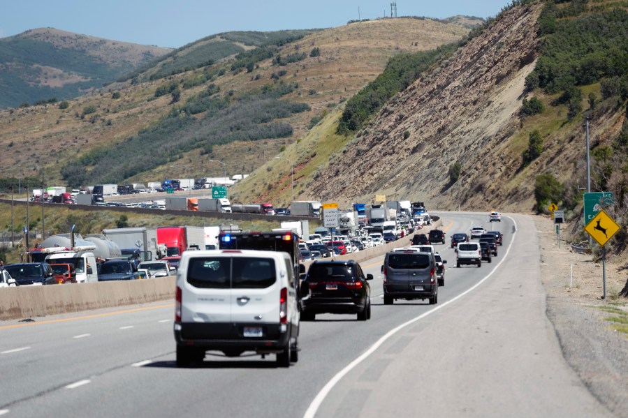 The motorcade for President Joe Biden moves along I-80 in Parleys Canyon, Utah en route to Park City, Utah, Thursday, Aug. 10, 2023. (AP Photo/Alex Brandon)