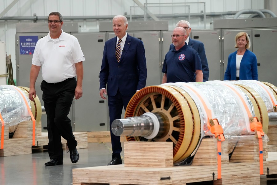 President Joe Biden and Mark Obradovich, Managing Director, Ingeteam, Inc., left, and others arrive at Ingeteteam Inc., in Milwaukee, Tuesday, Aug. 15, 2023. (AP Photo/Jacquelyn Martin)