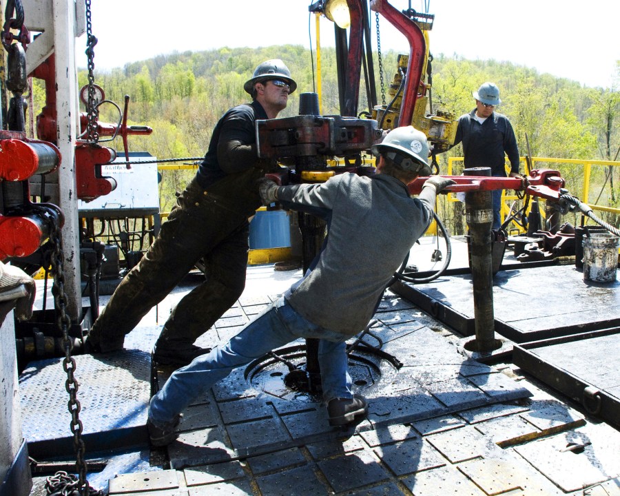 FILE - Workers move a section of well casing into place at a Chesapeake Energy natural gas well site near Burlington, Pa., in Bradford County, on April 23, 2010. A team of that has spent four years studying the health effects of natural gas fracking in southwestern Pennsylvania is set to present its findings Tuesday, Aug. 15, 2023. (AP Photo/Ralph Wilson, File)