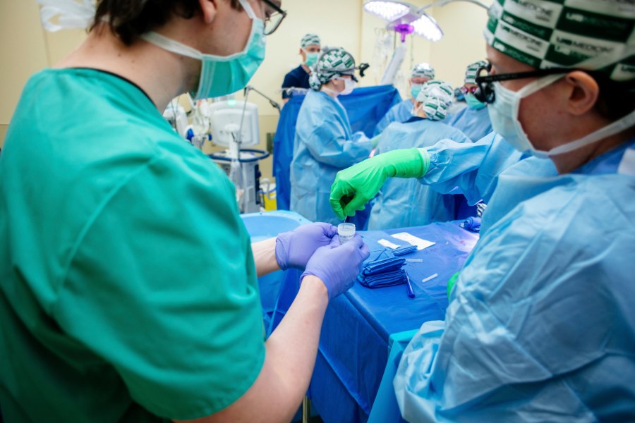 In this photo provided by the The University of Alabama at Birmingham, medical researchers collect a kidney biopsy during the transplant of a pig's kidney into a donated body on Feb. 15, 2023. Researchers around the country are racing to learn how to use animal organs to save human lives. (Steve Wood/UAB via AP)