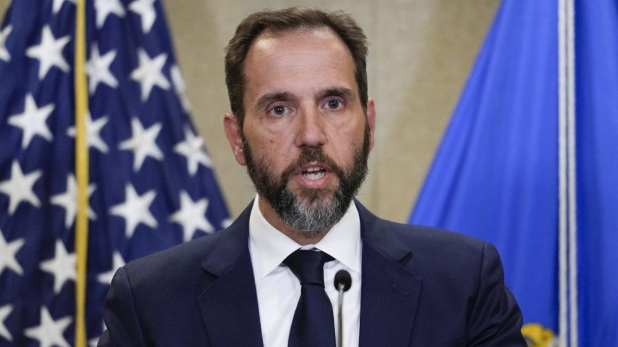 FILE - Special counsel Jack Smith speaks to the media about an indictment of former President Donald Trump, Aug. 1, 2023, at an office of the Department of Justice in Washington. A slim majority of Americans approve of the U.S. Justice Department indicting Donald Trump over his efforts to remain in office after losing the 2020 election, according to a new poll from The Associated Press-NORC Center for Public Affairs Research. (AP Photo/J. Scott Applewhite, File)