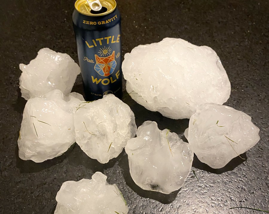 This Sunday, Aug. 13, 2023 photo provided by Jeff Ilg shows pieces of ice gathered after a chunk of ice estimated to be 15 to 20 pounds (6 to 9 kilograms) crashed onto the roof of his home, in Shirley, Mass., late Sunday. Ilg said he and his wife suspect the ice fell off an airplane traveling to Boston Logan International Airport. The couple and their two children were not hurt when the ice chunk hit the roof. (Jeff Ilg via AP)