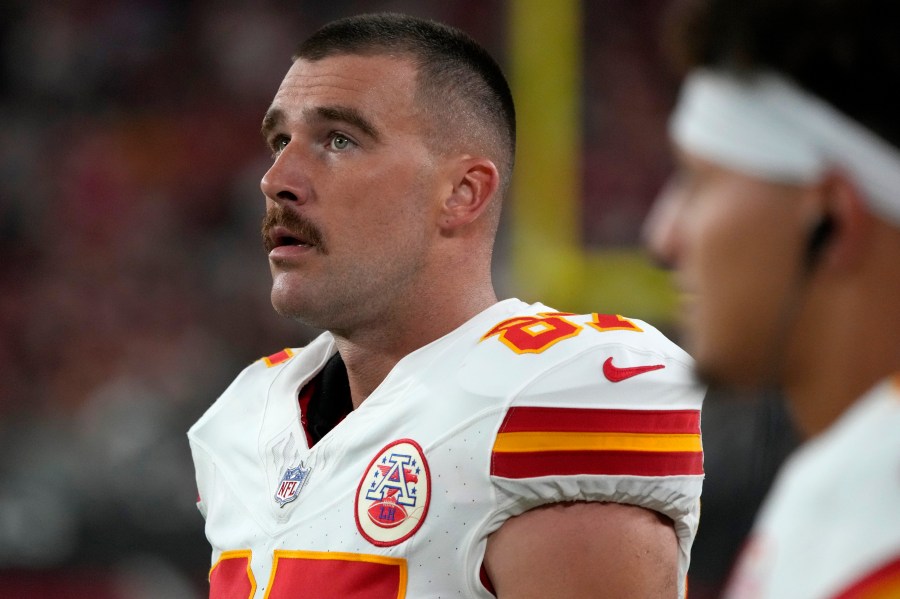 Kansas City Chiefs tight end Travis Kelce watches from the sidelines during the first half of an NFL preseason football game against the Arizona Cardinals, Saturday, Aug. 19, 2023, in Glendale, Ariz. (AP Photo/Rick Scuteri)