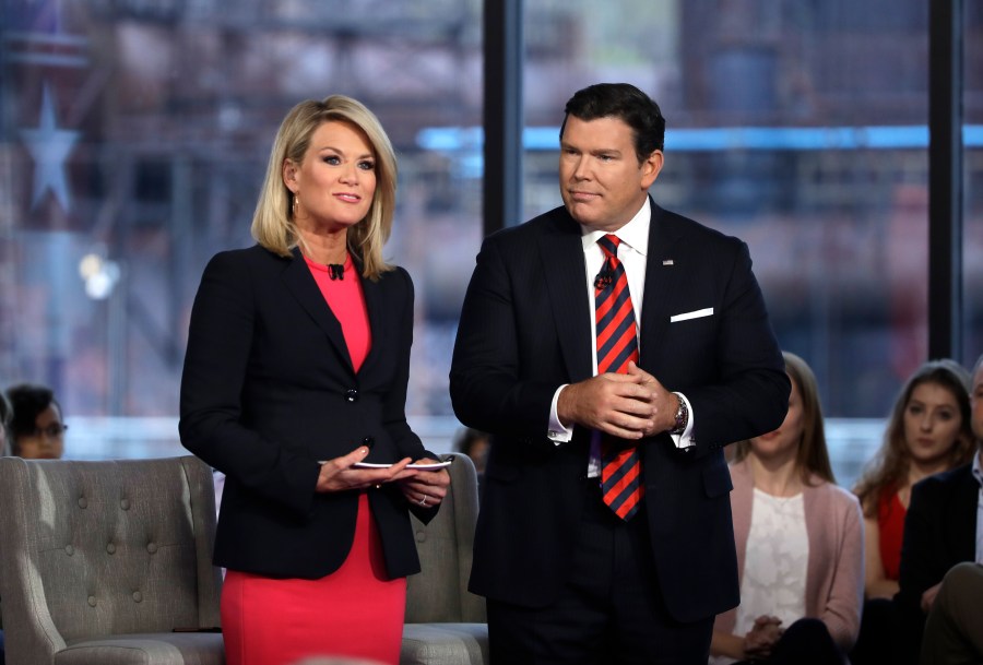 FILE - Bret Baier, right, and Martha MacCallum, left, stand during a Fox News town-hall style event, April 15, 2019 in Bethlehem, Pa. Baier and MacCallum moderated Fox News' two-hour Republican presidential debate Wednesday night. (AP Photo/Matt Rourke, File)