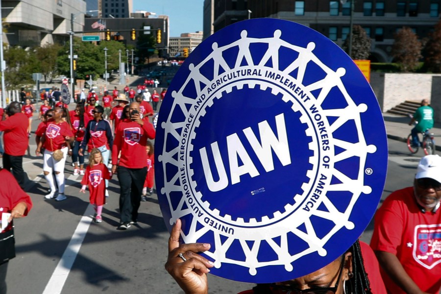 FILE - United Auto Workers members walk in the Labor Day parade in Detroit, Sept. 2, 2019. Auto workers are voting overwhelmingly to give union leaders the authority to call strikes against Detroit car companies if a contract agreement isn’t reached. The United Auto Workers union said Friday, Aug. 25, 2023, that results are still being tallied, but so far 97% have voted in favor of authorizing one or more strikes against Stellantis, General Motors and Ford. (AP Photo/Paul Sancya, File)