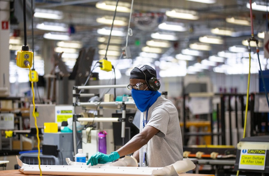 File - A worker prepares materials and construction parts at the Boeing Interiors Responsibility Center in North Charleston, S.C., on May 31, 2023. On Wednesday, the Commerce Department issues its second of three estimates of how the U.S. economy performed in the second quarter of 2023.(Gavin McIntyre/The Post And Courier via AP, Pool, File)