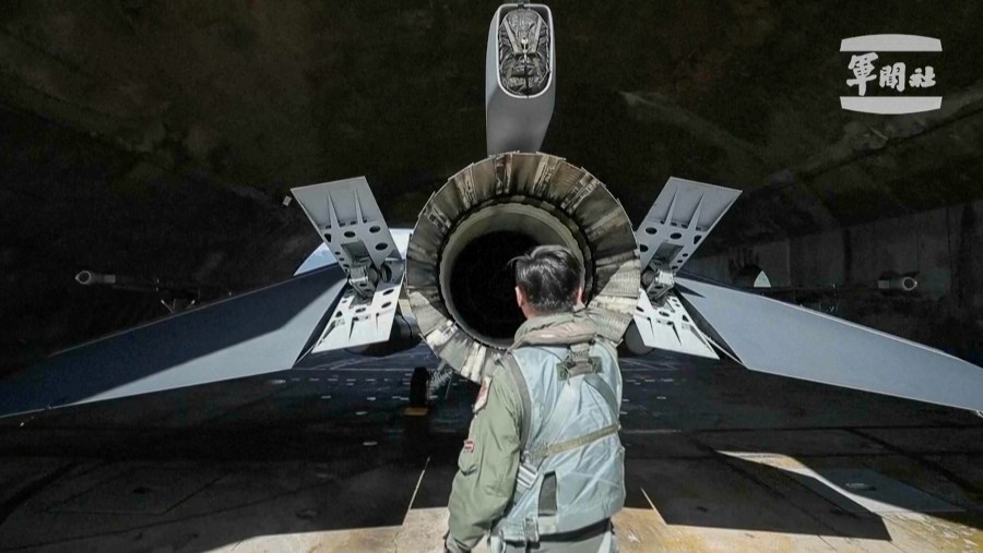 In this grab from video released by the Taiwan Military News Agency, a pilot checks on a F-16s at Hualien Airbase in Taiwan's southeastern Hualien county, Sunday, Aug. 20, 2023. Taiwan deployed aircraft and vessels and activated land-based missile systems after the Chinese military launched drills around Taiwan on Saturday as a "stern warning" over what it called collusion between "separatists and foreign forces," its defense ministry said, days after the island's vice president stopped over in the United States. (Taiwan Military News Agency via AP)