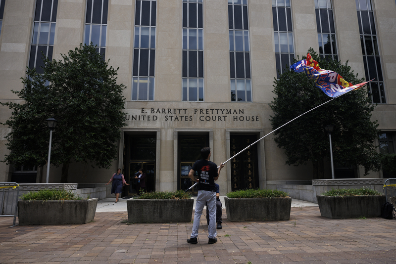 A protester in support of former Prudent Trump is seen at the E. Barrett Prettyman United States District Court House