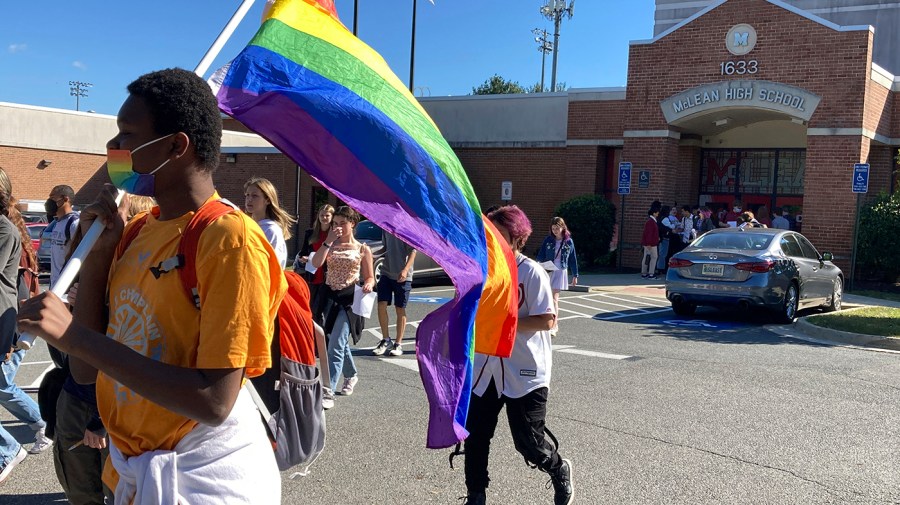 FILE - Students walk out of classes at McLean High School in McLean, Va., Sept. 27, 2022, to protest Republican Gov. Glenn Youngkin's proposed changes to the state's guidance on district policies for transgender students.