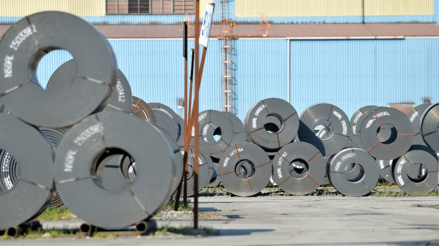 Rolls of steel weighing as much as 20 tons each await shipment the NUCOR Steel Gallatin plant, Wednesday, July 25, 2018, in Ghent, Ky. (AP Photo/Timothy D. Easley)