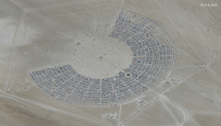 In this satellite photo provided by Maxar Technologies, an overview of Burning Man festival in Black Rock, Nev on Monday, Aug. 28, 2023. (©2023 Maxar Technologies via AP)