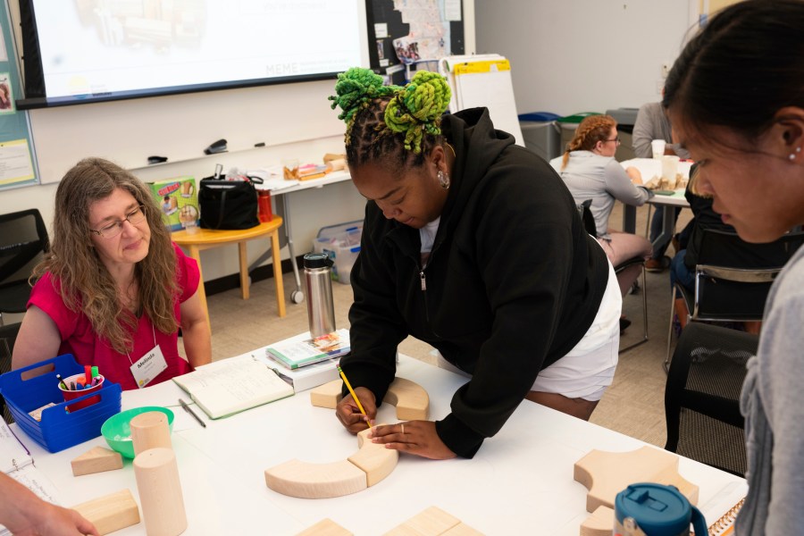 Ivory McCormick, a kindergarten teacher from Atlanta, credits her school's decision to hire a math specialist last year with helping change the way she feels about teaching the subject, at the Erickson Institute's summer learning program in Chicago on Wednesday, July 12, 2023. McCormick moved up this year to teaching first grade. She credits her school’s decision to hire a math specialist last year with helping change how she feels about teaching the subject. (Camilla Forte/The Hechinger Report via AP)