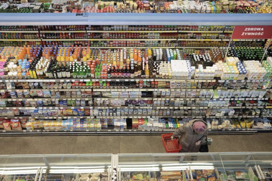 FILE - A woman shops at a supermarket in Warsaw, Poland, on Dec. 9, 2022. Poland's central bank lowered its interest rates by 75 basis points on Wednesday Sept. 6, 2023 despite the country's double-digit inflation rate. The move prompted concerns that the central bank was wading into politics with a premature rate cut to help the populist governing party ahead of parliamentary elections next month.(AP Photo/Michal Dyjuk, File)