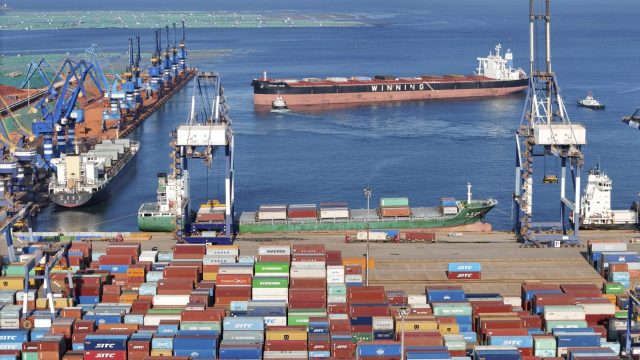 FILE - Containers wait to be transported on a dockyard in Yantai in eastern China's Shandong province on Aug. 6, 2023. China’s exports declined at a slower pace in August, even as the world’s second biggest economy remains under pressure amid weaker demand both domestically and abroad, according to customs data Thursday, Sept. 7, 2023. (Chinatopix via AP, File)