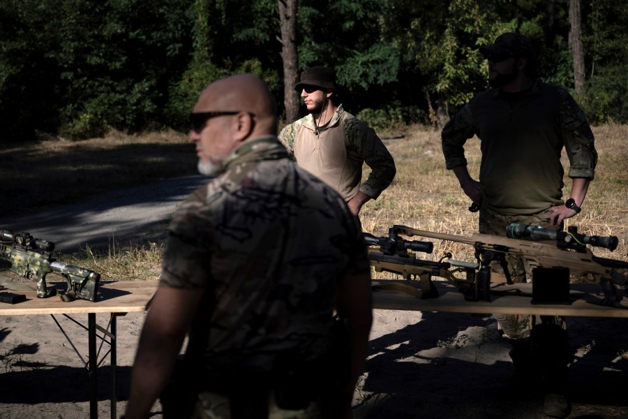 A member of the State Border Guard of Ukraine waits to show weapons to U.S, Secretary of State Antony Blinken as he tours a State Border Guard of Ukraine Detached Commandant Office of Security and Resource Supply site Thursday, Sept. 7, 2023, in the Kyiv Oblast, Ukraine. (Brendan Smialowski/Pool via AP)