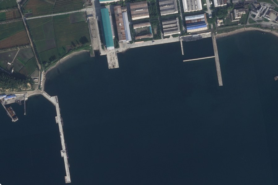 In this satellite photo taken by Planet Labs PBC, the North Korean port of Sinpo is seen Thursday, Sept. 7, 2023, with a submarine seen in the lower lefthand corner of the image. North Korea said Friday, Sept. 8, 2023, its new submarine has nuclear attack capabilities. It's been developing for years, a step leader Kim Jong Un described as crucial in his efforts to build a nuclear-armed navy to counter the United States and its Asian allies. Satellite photos analyzed by The Associated Press on Friday placed the submarine and the ceremony that Kim took part in at the port city of Sinpo. (Planet Labs PBC via AP)