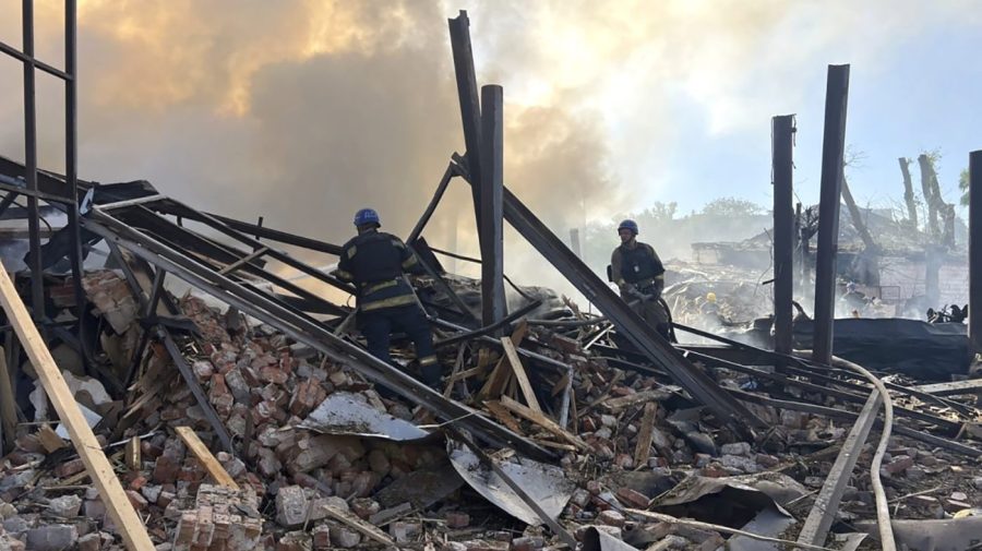 In this photo provided by the Ukrainian Emergency Service, emergency services personnel work to extinguish a fire following a Russian attack in Kryvyi Rih, Ukraine, Friday, Sept. 8, 2023. (Ukrainian Emergency Service via AP)