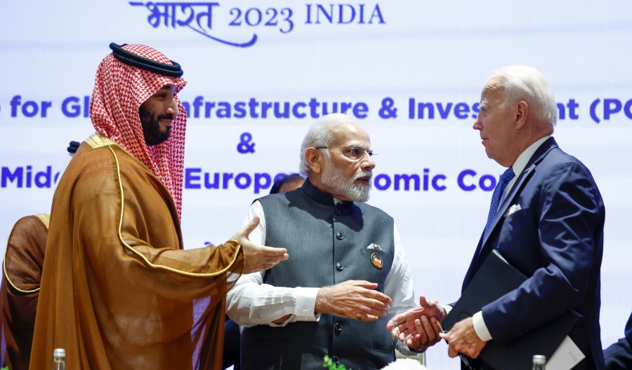 Saudi Arabian Crown Prince Mohammed bin Salman Al Saud, left, U.S. President Joe Biden, right, and Indian Prime Minister Narendra Modi talk on the day of the G20 summit in New Delhi, India, Sept. 9, 2023. (AP Photo/Evelyn Hockstein, Pool)