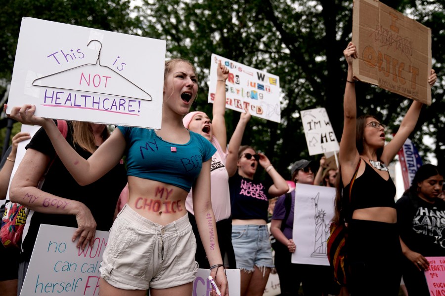 FILE - People rally in support of abortion rights, July 2, 2022, in Kansas City, Mo. On Monday, Sept. 11, 2023, abortion advocates asked a judge to rewrite what they call misleading descriptions of several constitutional amendments on abortion rights that voters could see on Missouri’s 2024 ballot. (AP Photo/Charlie Riedel, File)