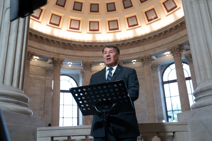 Sen. Mike Rounds, R-S.D., does a television news interview before joining Senate Majority Leader Chuck Schumer, D, N.Y., to convene a closed-door gathering of leading tech CEOs to discuss the priorities and risks surrounding artificial intelligence and how it should be regulated, at the Capitol in Washington, Wednesday, Sept. 13, 2023. (AP Photo/J. Scott Applewhite)