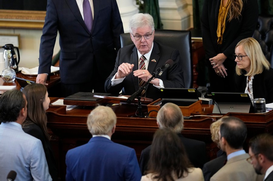 Texas Lt. Gov. Dan Patrick, top center, talks with defense and prosecution attorneys during the impeachment trial for suspended Texas Attorney General Ken Paxton in the Senate Chamber at the Texas Capitol, Thursday, Sept. 14, 2023, in Austin, Texas. (AP Photo/Eric Gay)