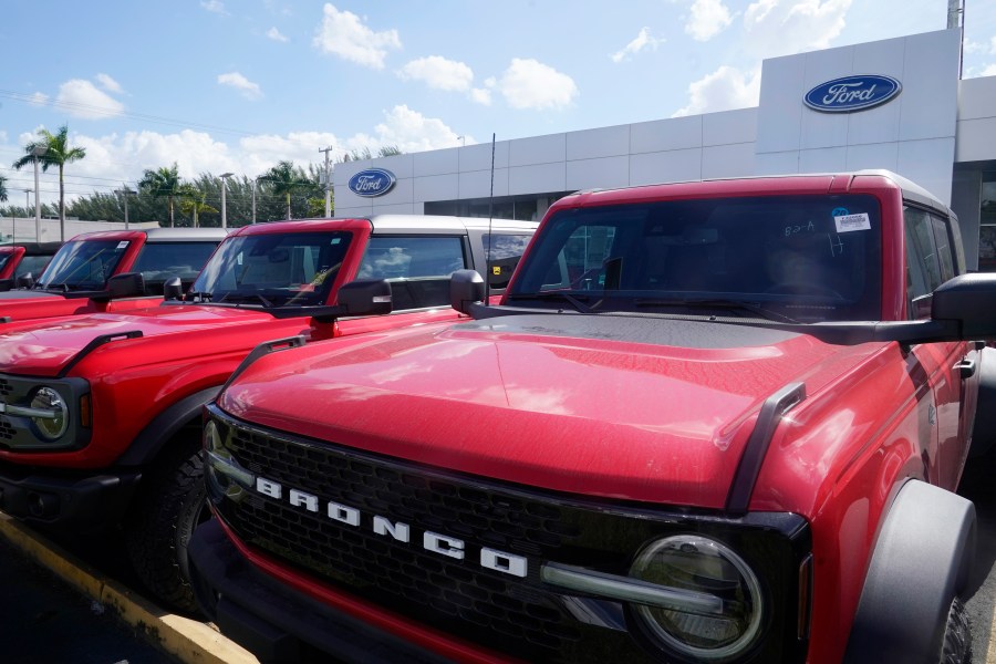 File - Ford Broncos line the front of Gus Machado's Ford dealership on Jan. 23, 2023, in Hialeah, Fla. The strike by auto workers is almost certain to lead to higher prices for car buyers; it's only a matter of whether panic buying will make dealer lots look empty sooner than analysts expect. (AP Photo/Marta Lavandier, File)