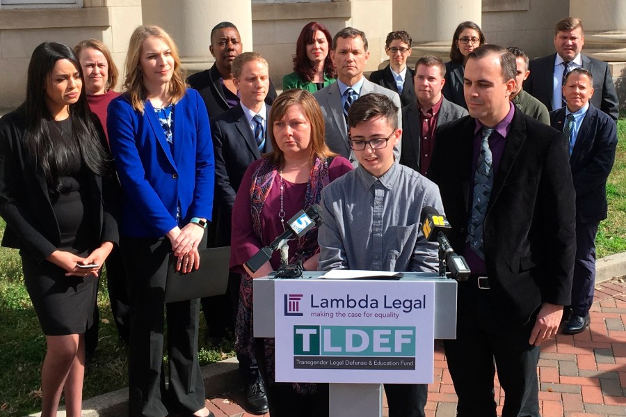 FILE - Connor Thonen-Fleck addresses reporters while his parents stand by his side, Monday March 11, 2019, in Durham, N.C., at the announcement of a lawsuit against North Carolina officials over how the state health plan is run. A federal appeals court is considering cases out of North Carolina and West Virginia that could have broad-ranging implications on whether individual states are constitutionally required to cover healthcare for transgender people with government-sponsored insurance. (AP Photo/ Jonathan Drew, FIle)