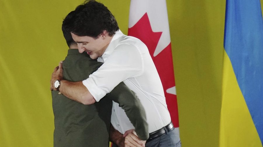 Prime Minister Justin Trudeau, right, embraces Ukrainian President Volodymyr Zelenskyy as he is introduced during a rally at the Fort York Armoury in Toronto on Friday, Sept. 22, 2023. (Chris Young/The Canadian Press via AP)