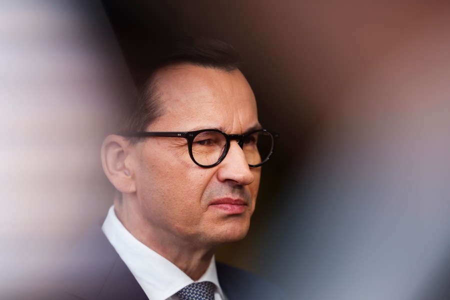 FILE - Poland's Prime Minister Mateusz Morawiecki talks to journalists as he arrives for the third EU-CELAC summit in Brussels, Belgium, Tuesday, July 18, 2023. Polish and U.S. officials signed an agreement Wednesday, Sept. 27, 2023 in Warsaw for the construction of Poland's first nuclear power plant, part of an effort by the Central European nation to move away from polluting fossil fuels. (AP Photo/Geert Vanden Wijngaert, File)