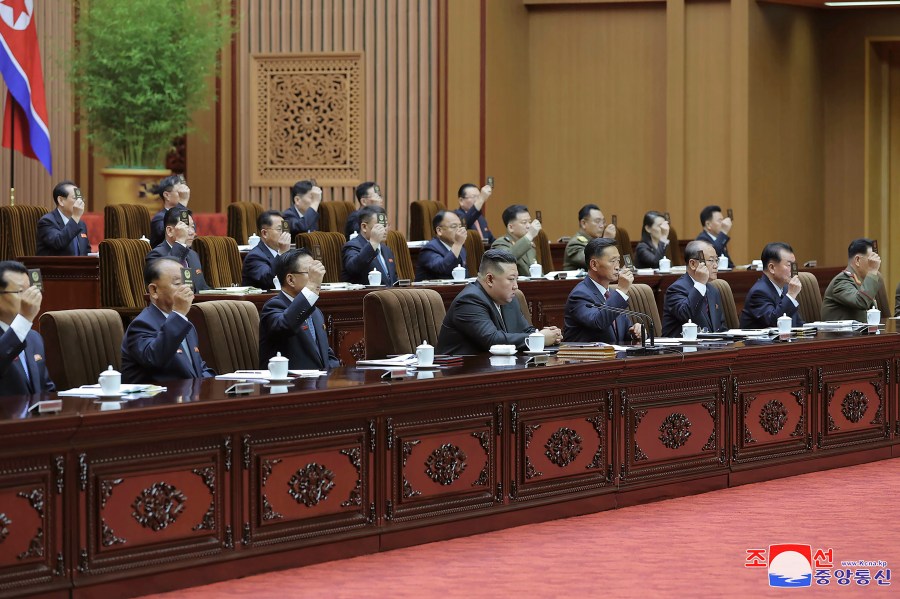 In this photo taken during a two-day session on Sept. 26-27, 2023 and provided by the North Korean government, North Korean leader Kim Jong Un, bottom center, attends a meeting of the country's parliament in Pyongyang, North Korea. Independent journalists were not given access to cover the event depicted in this image distributed by the North Korean government. The content of this image is as provided and cannot be independently verified. Korean language watermark on image as provided by source reads: "KCNA" which is the abbreviation for Korean Central News Agency. (Korean Central News Agency/Korea News Service via AP)