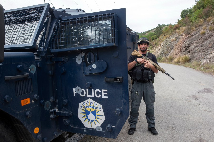 Kosovo police officers secure the area outside the Banjska monastery in the village of Banjska, Kosovo on Wednesday, Sept. 27, 2023. Police on Wednesday allowed media into the village of Banjska, where a daylong shootout between armed Serbs and Kosovar police on Sunday left one officer and three gunmen dead. (AP Photo/Visar Kryeziu)