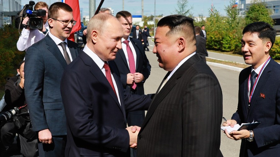 Russian President Vladimir Putin, left, and North Korea's leader Kim Jong Un shake hands during their meeting at the Vostochny cosmodrome outside the city of Tsiolkovsky, about 200 kilometers (125 miles) from the city of Blagoveshchensk in the far eastern Amur region, Russia, on Wednesday, Sept. 13, 2023.