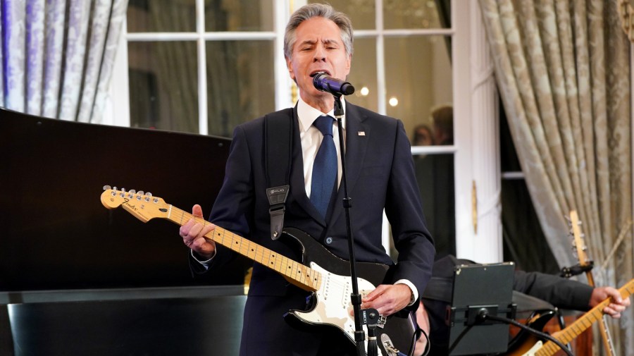 Secretary of State Antony Blinken performs onstage during the launch of the Global Music Diplomacy Initiative at the Department of State on September 27, 2023, in Washington, D.C. 