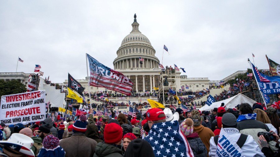 FILE - Rioters loyal to President Donald Trump rally at the U.S. Capitol in Washington on Jan. 6, 2021.