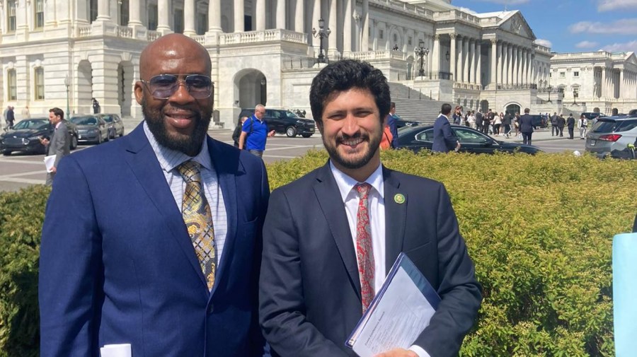 Robert Panton poses alongside Rep. Greg Casar (D-Texas) at a March press conference in support of the New Way Forward Act, where he spoke.