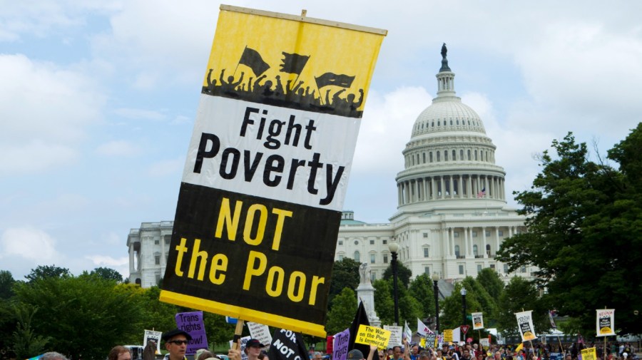 File - Demonstrators march outside the U.S. Capitol during the Poor People's Campaign rally at the National Mall in Washington on Saturday, June 23, 2018.