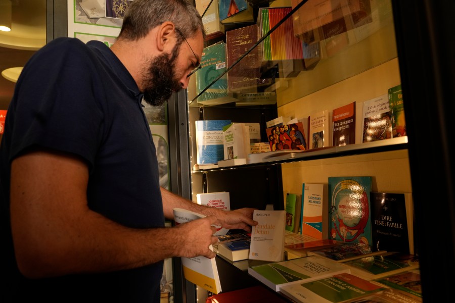 Copies of Pope Francis' latest encyclical letter on environment "Laudate Deum" are prepared for sale in a bookshop in Rome, Wednesday, Oct. 4, 2023. Pope Francis shamed and challenged world leaders on Wednesday to commit to binding targets to slow climate change before it's too late, warning that God's increasingly warming creation is fast reaching a "point of no return." (AP Photo/Andrew Medichini)