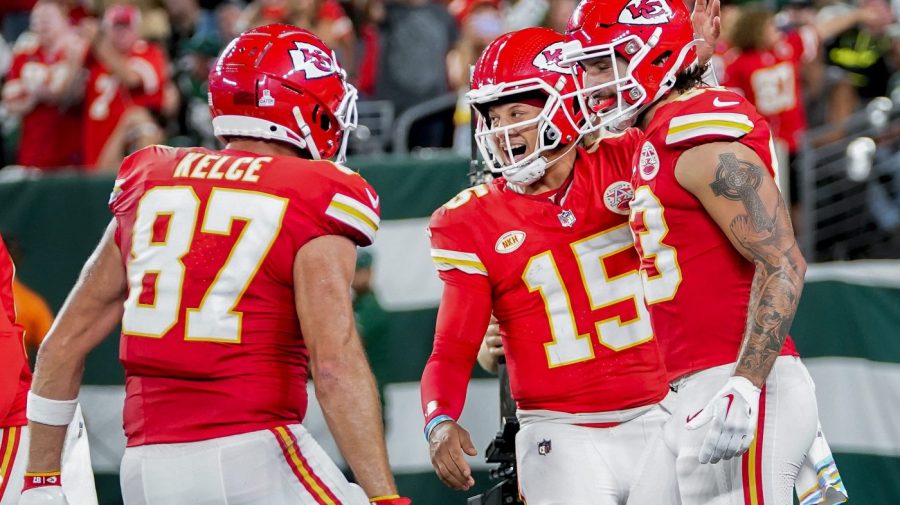 Kansas City Chiefs quarterback Patrick Mahomes (15) celebrates with tight end Travis Kelce (87) and tight end Noah Gray (83) after a touchdown against the New York Jets during the first quarter of an NFL football game, Sunday, Oct. 1, 2023, in East Rutherford, N.J. (AP Photo/Frank Franklin II)