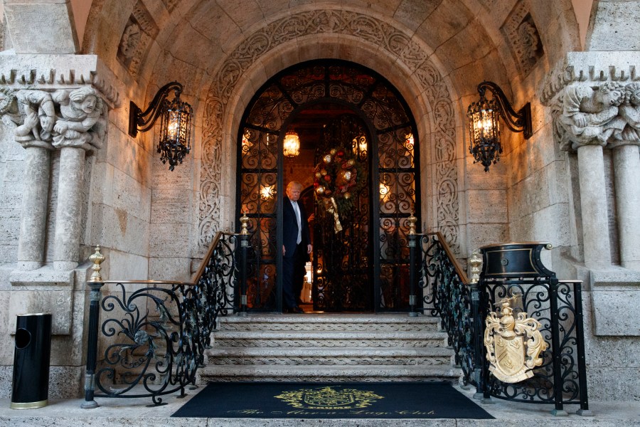 FILE - President-elect Donald Trump arrives to speak to reporters at his Mar-a-Lago estate, Wednesday, Dec. 28, 2016, in Palm Beach, Fla. (AP Photo/Evan Vucci, File)